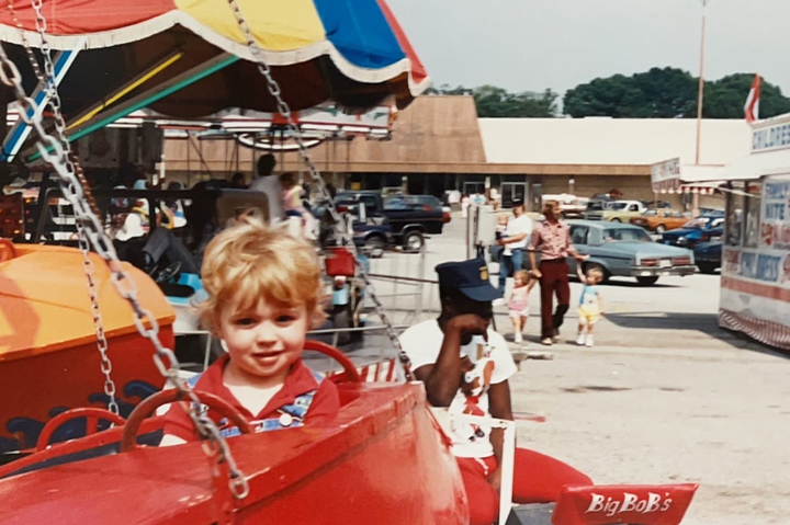 Matthew Warren, as a youngster, sometime in the 1980's, riding a carnival airplane ride.